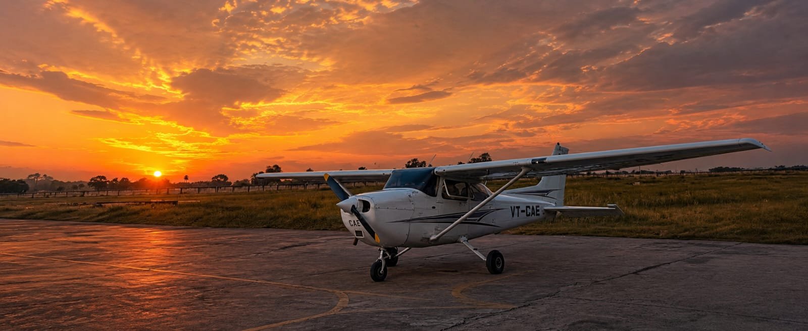 Aircraft on runway at sunset